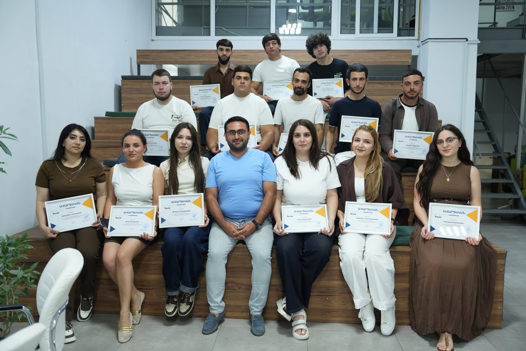 Train2b course graduation group photo with students and instructor